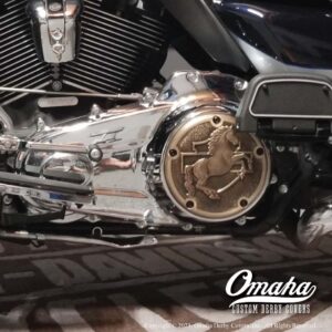 Harley davidson motorcycle with custom derby cover installed on the side.