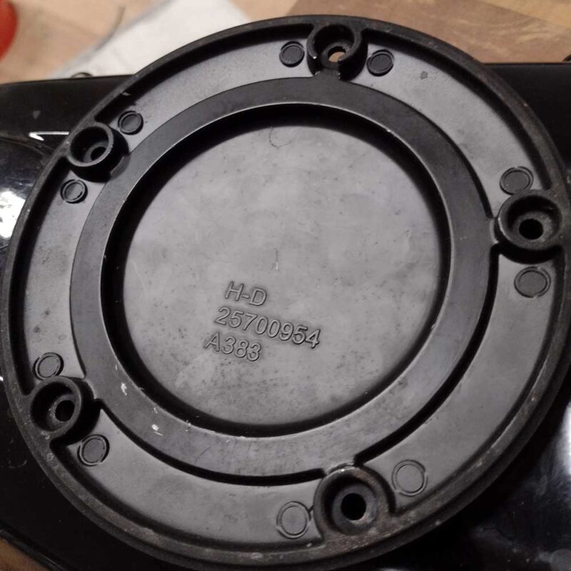 Back side view of a Harley Davidson Milwaukee 8 Softail derby cover