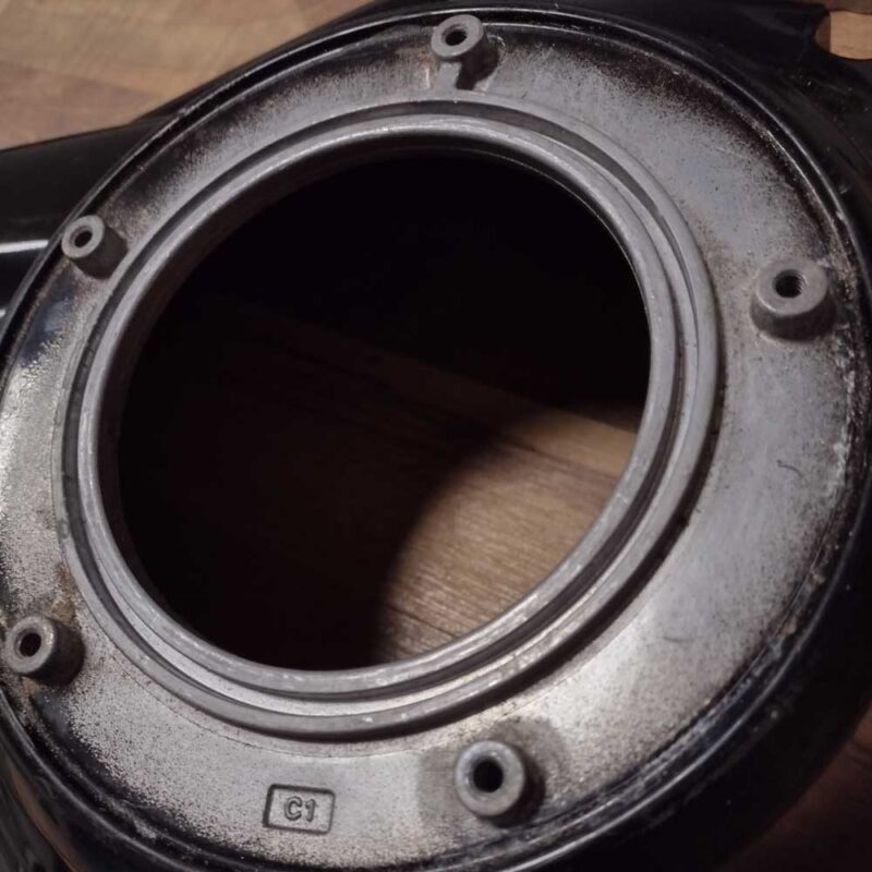 Harley Davidson Milwaukee 8 Softail outer primary showing a detail shot of where the derby cover is attached.