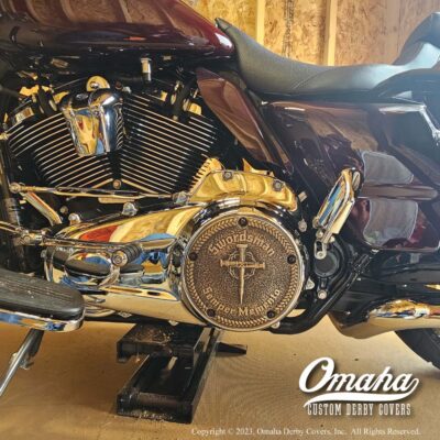 Bronze custom derby cover for Harley Davidson motorcycle installed on bike
