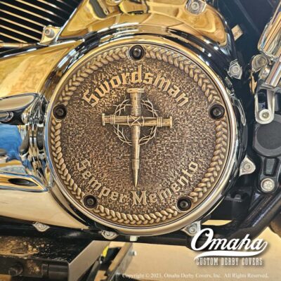 Bronze custom derby cover for Harley Davidson motorcycle installed on bike