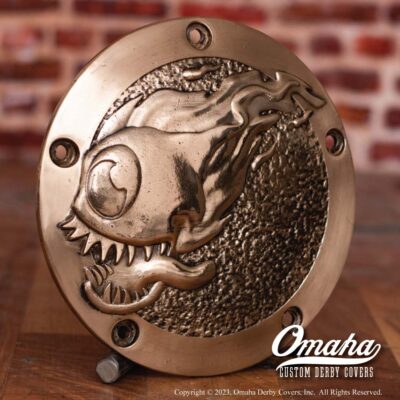 Custom derby cover for Harley Davidson motorcycle with flaming eyeball graphics
