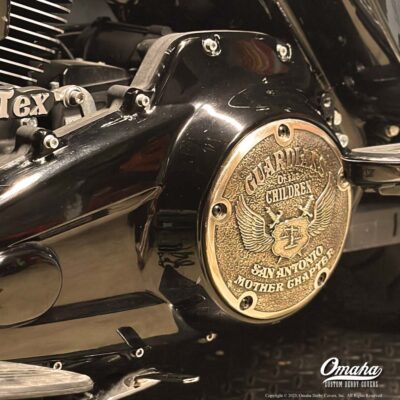 Harley-Davidson motorcycle with custom derby cover with Guardians of the Children club logo