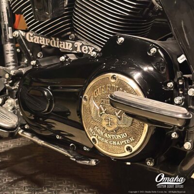 Harley-Davidson motorcycle with custom derby cover with Guardians of the Children club logo
