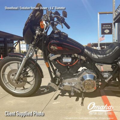 Custom derby cover with "Don't Fucking Die" design mounted on a Harley-Davidson FXRS motorcycle, parked in front of the Harley-Davidson museum in Milwaukee