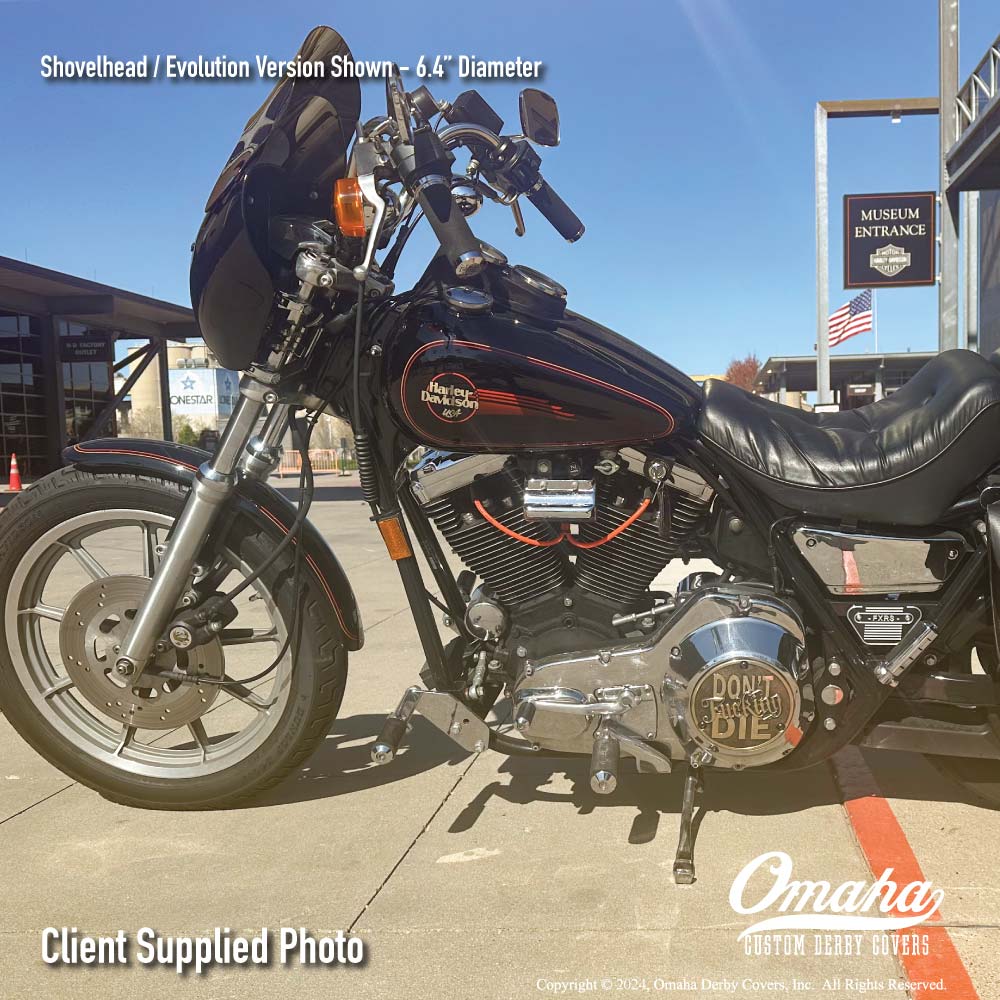Custom derby cover with "Don't Fucking Die" design mounted on a Harley-Davidson FXRS motorcycle, parked in front of the Harley-Davidson museum in Milwaukee