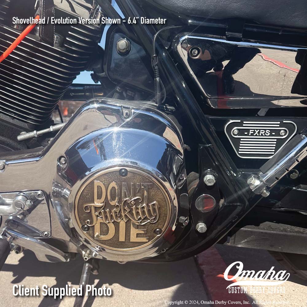 Custom derby cover with "Don't Fucking Die" design installed on a Harley-Davidson FXRS motorcycle