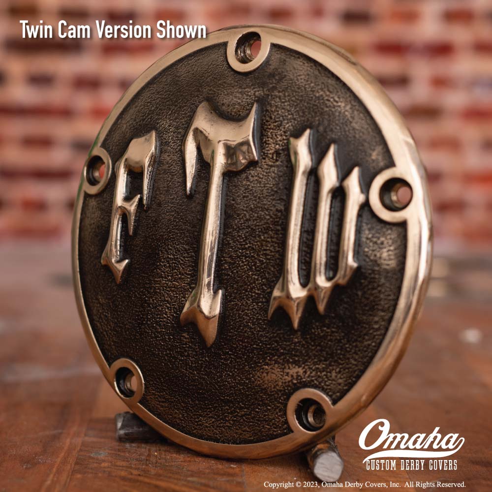 Custom derby cover for Harley-Davidson motorcycle with "FTW" decoration.