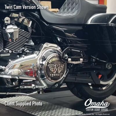 Custom bronze derby cover installed on a Harley-Davidson motorcycle