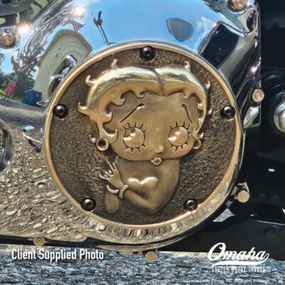 Betty Boop custom derby cover installed on a Harley-Davidson motorcycle