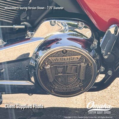 Custom bronze derby cover installed on a Harley-Davidson motorcycle