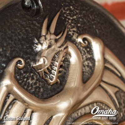 Custom bronze derby cover for Harley-Davidson motorcycle with custom sculpted dragon design