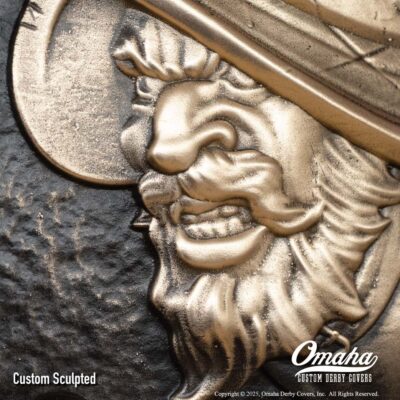 Custom cast bronze derby cover for Harley-Davidson motorcycle with Conquistador design