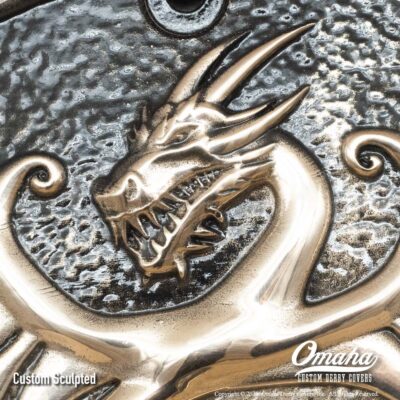 Custom bronze derby cover for Harley-Davidson motorcycle with custom sculpted dragon design