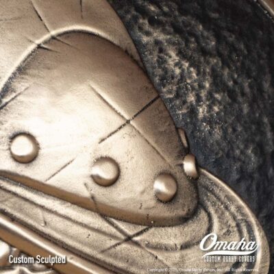 Custom cast bronze derby cover for Harley-Davidson motorcycle with Conquistador design