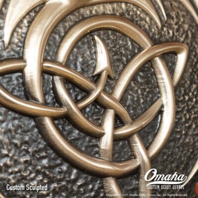 Custom bronze derby cover for Harley-Davidson motorcycle with custom sculpted dragon design