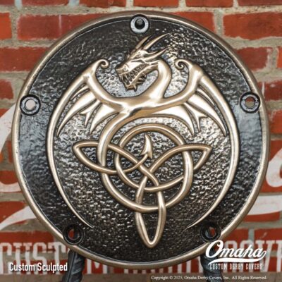 Custom bronze derby cover for Harley-Davidson motorcycle with custom sculpted dragon design