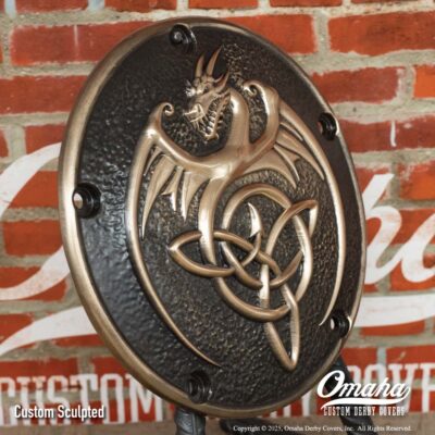 Custom bronze derby cover for Harley-Davidson motorcycle with custom sculpted dragon design