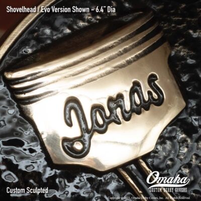 Custom derby cover for Harley-Davidson with crossed pistons design