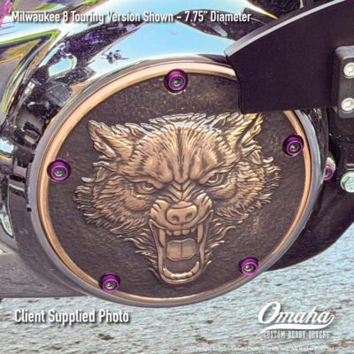 Custom derby cover on Harley-Davidson motorcycle with lone wolf design